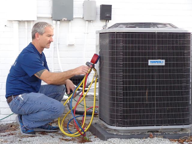 Man working on HVAC Unit